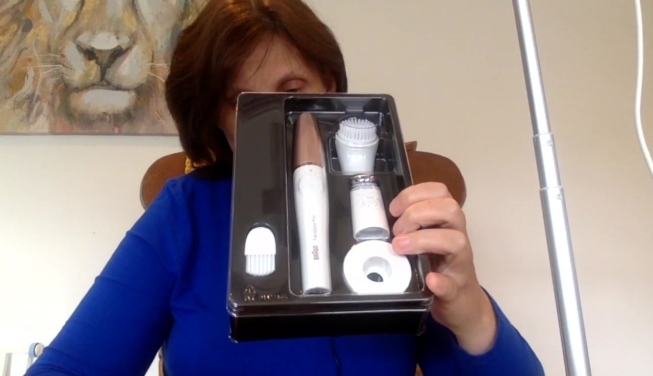 The Braun FaceSpa Pro and its accessories in the box.
