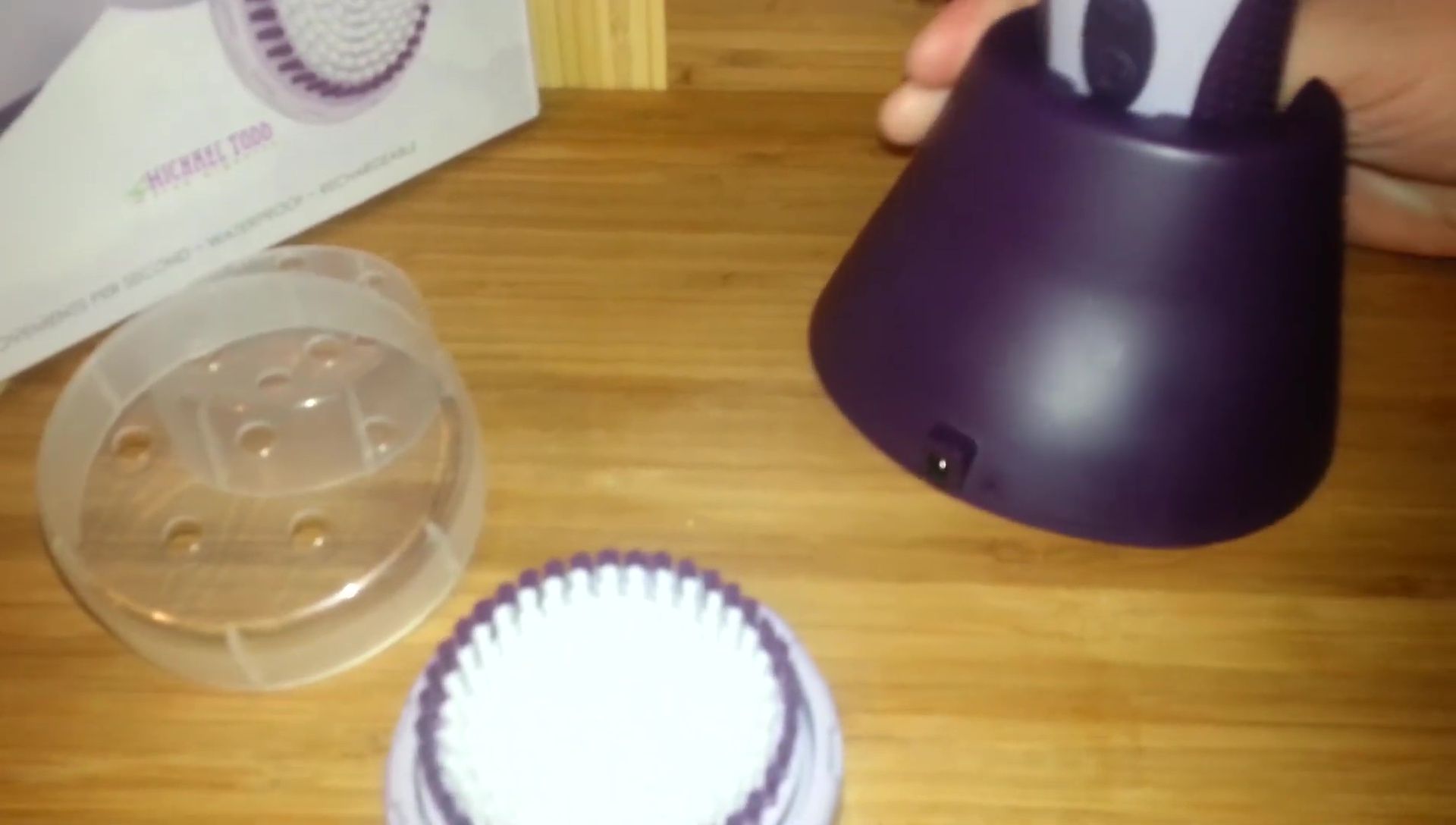 The reviewer holding the Soniclear brush.