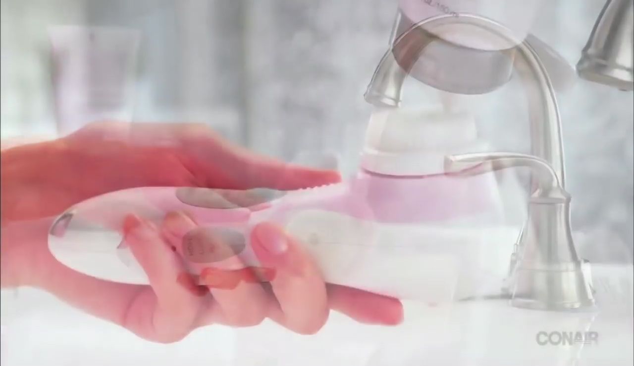 Demonstration of applying cleanser to the wet brush head.