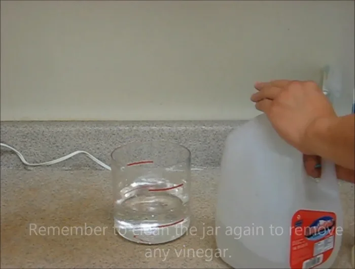Empty, clean, and dry the jar. Refill with clean distilled water, reattach to the steamer, and run for an additional 5 minutes to remove vinegar smells.