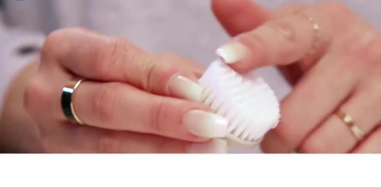 Close-up of the exfoliating brush head with firmer bristles.
