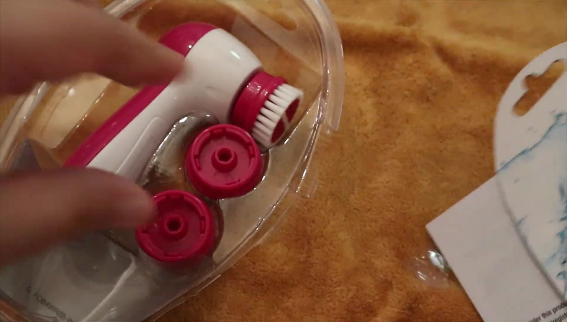 Close-up of the instruction manual and the brush.