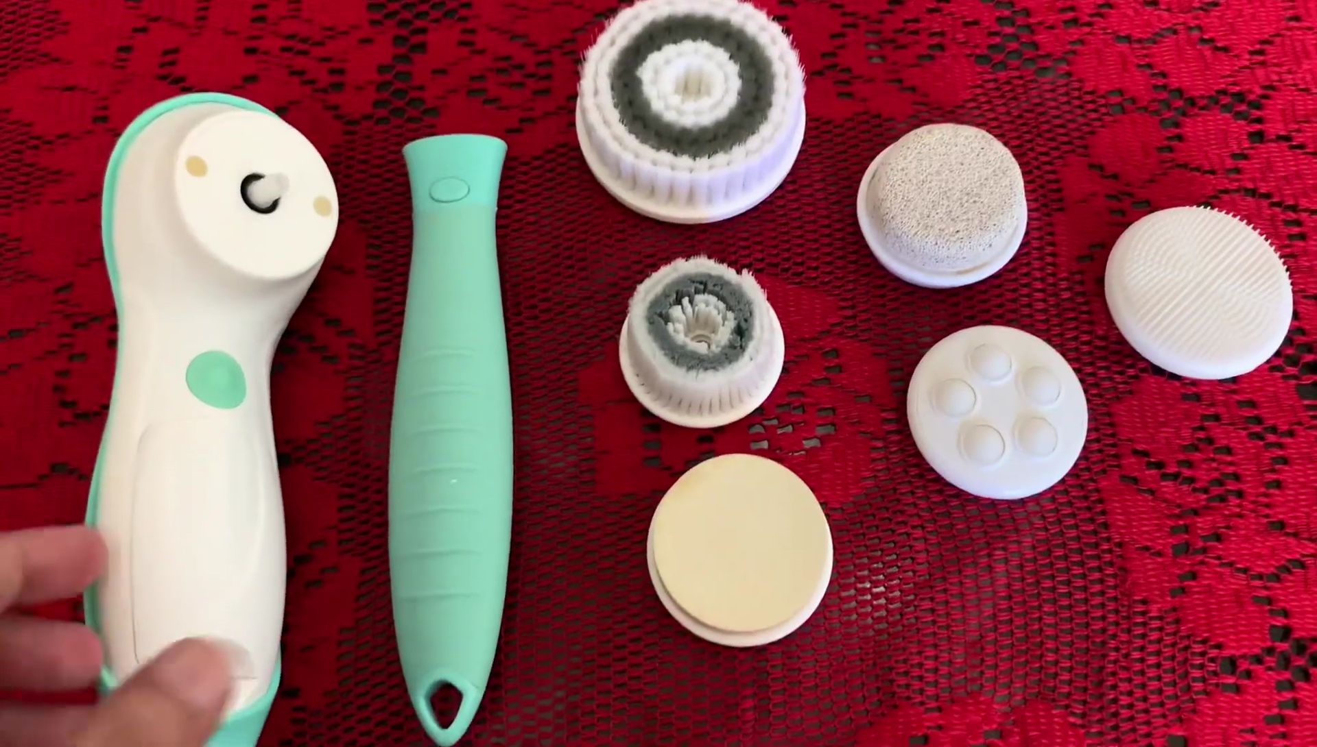 The two main parts of the brush are shown: the handle and the brush head attachment.