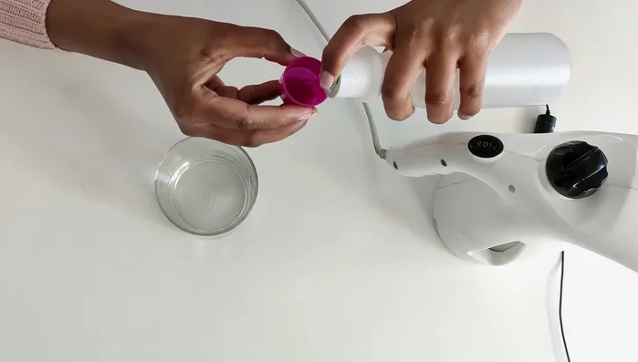 Prepare the cleaning solution: Mix two tablespoons of plain vinegar with distilled water.