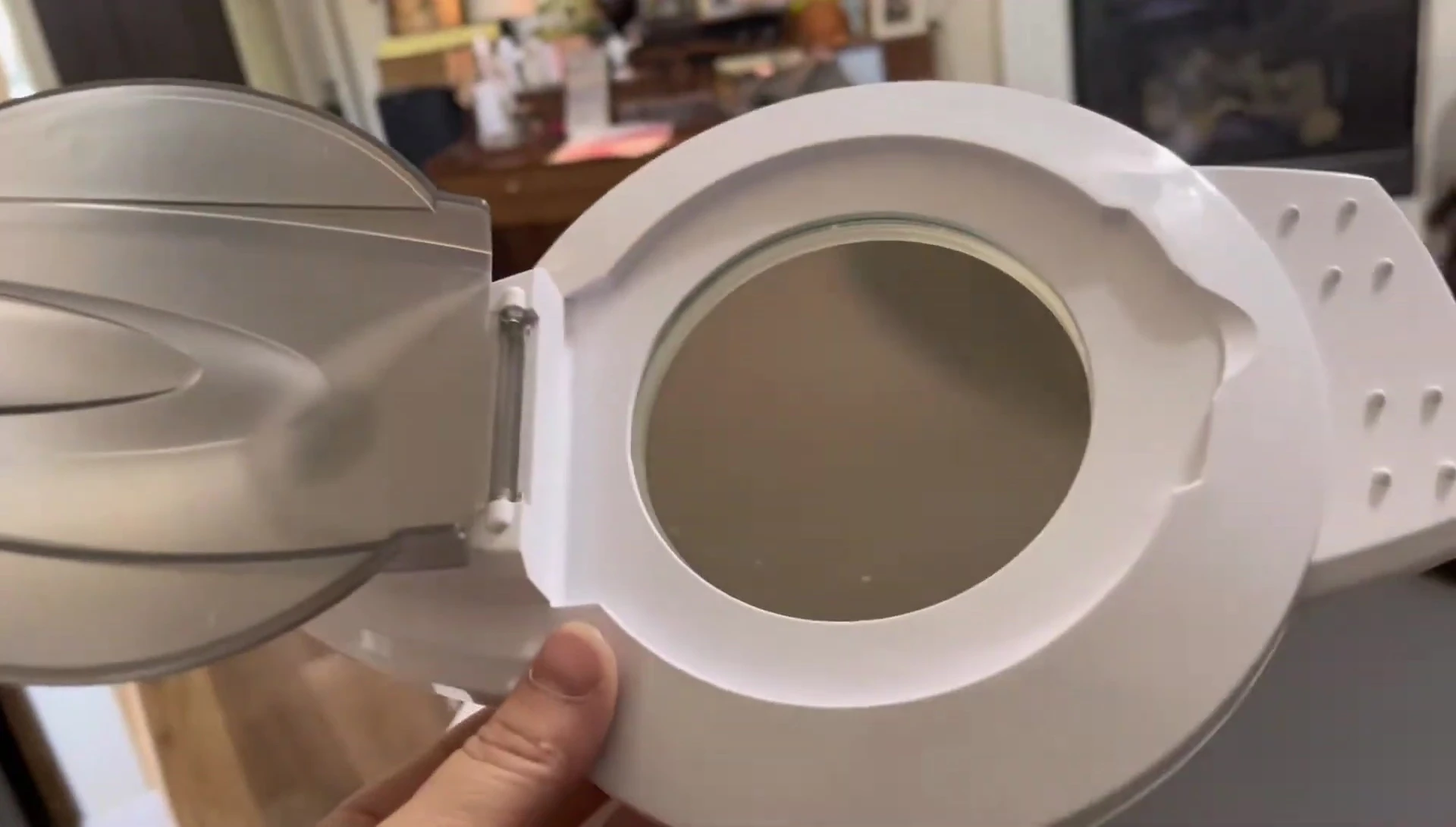The facial steamer with its 5x magnification mirror and integrated lighting.