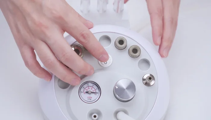 Perform the treatment for approximately 10 minutes. Turn off the machine, detach the diamond tape, and discard the cotton filter.