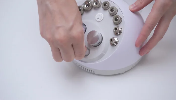 Take out the white rubber hose and insert one end into the inlet and the other end into a diamond tip.