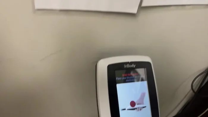 The machine will send a small current through your torso to measure body composition.