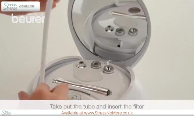Inserting a new filter into the device.