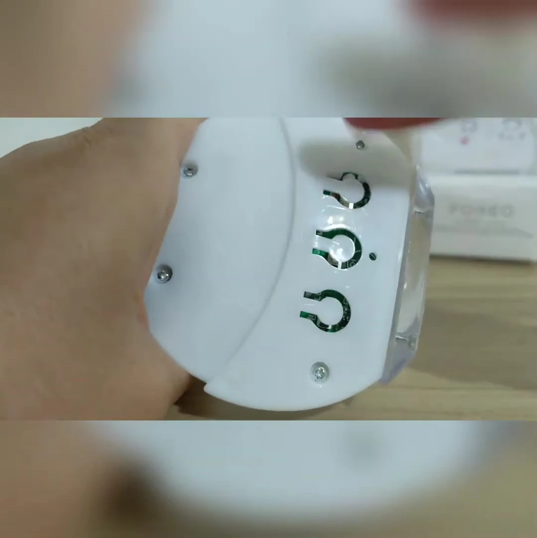 Close-up of the disassembled counterfeit Luna Mini 2 showing gaps and holes.