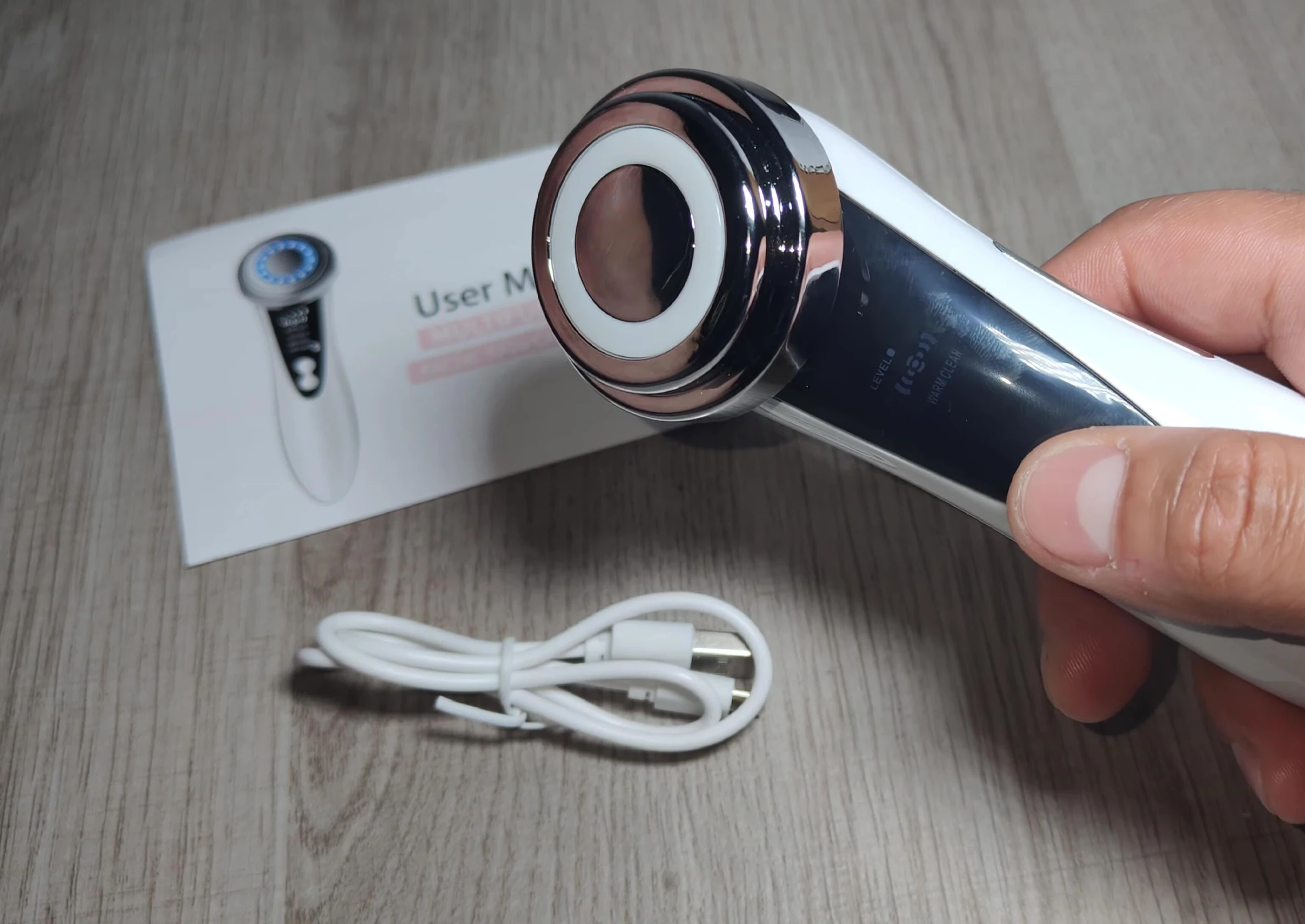 Demonstrating the massager's warm vibration