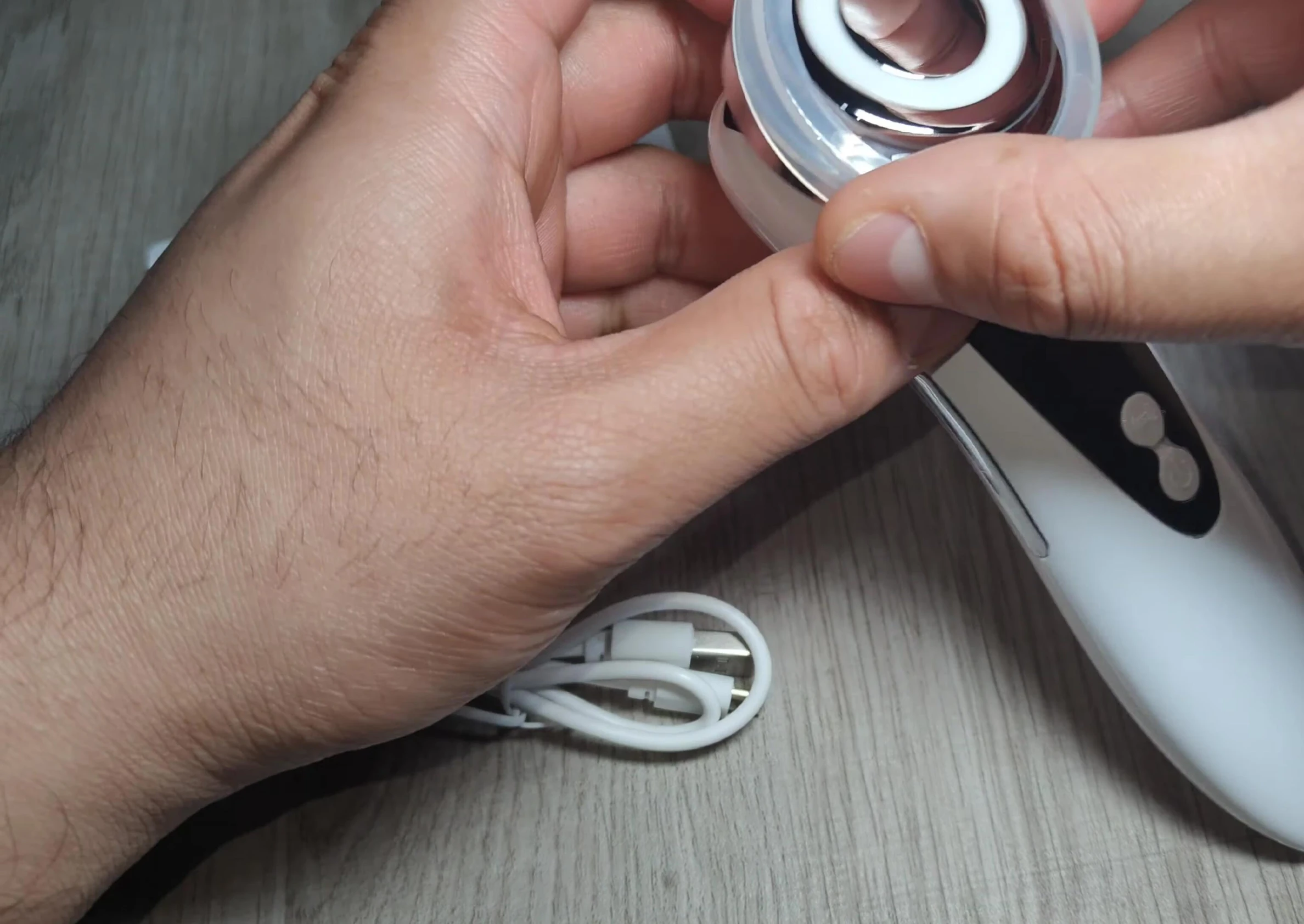 Close-up of the massager device and protective cover