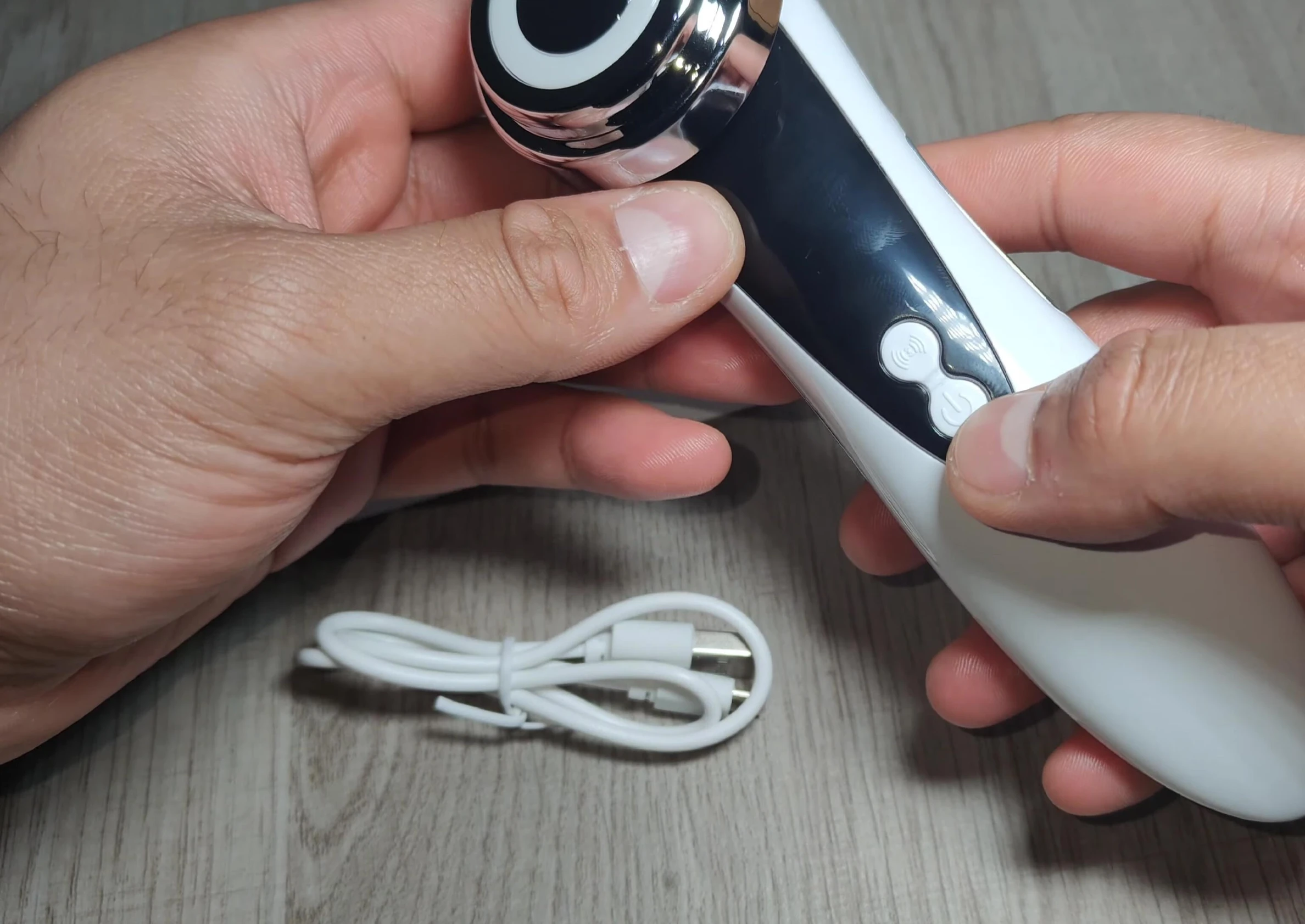 The device's power button and micro USB charging port