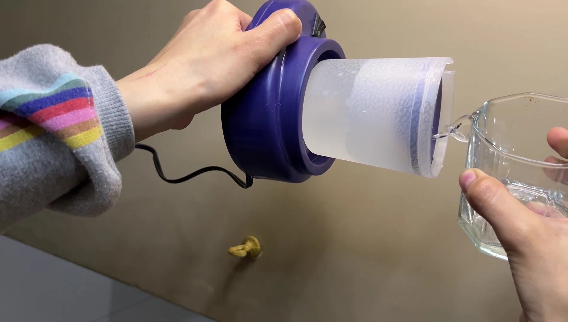 Close-up demonstrating the water filling process