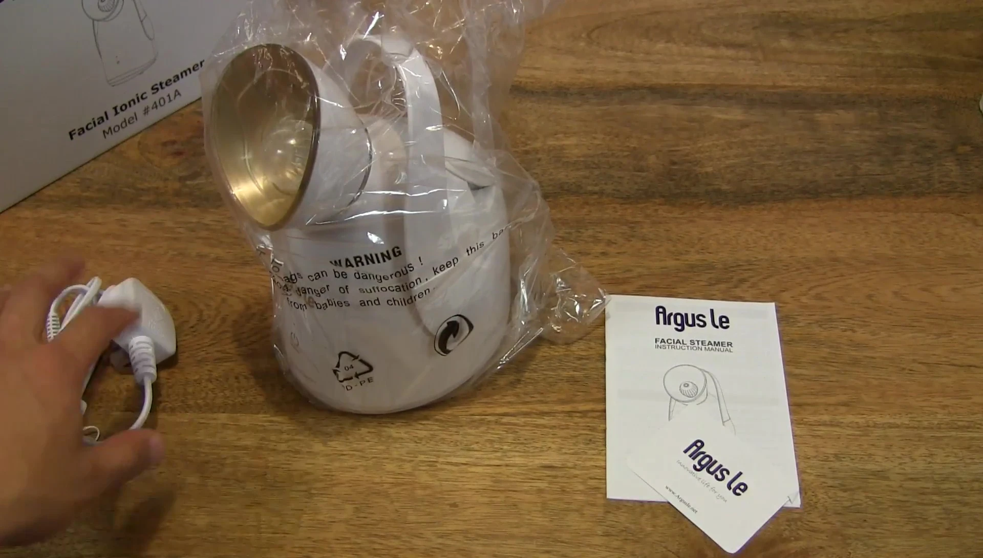 Close-up view of the user manual and coupon card