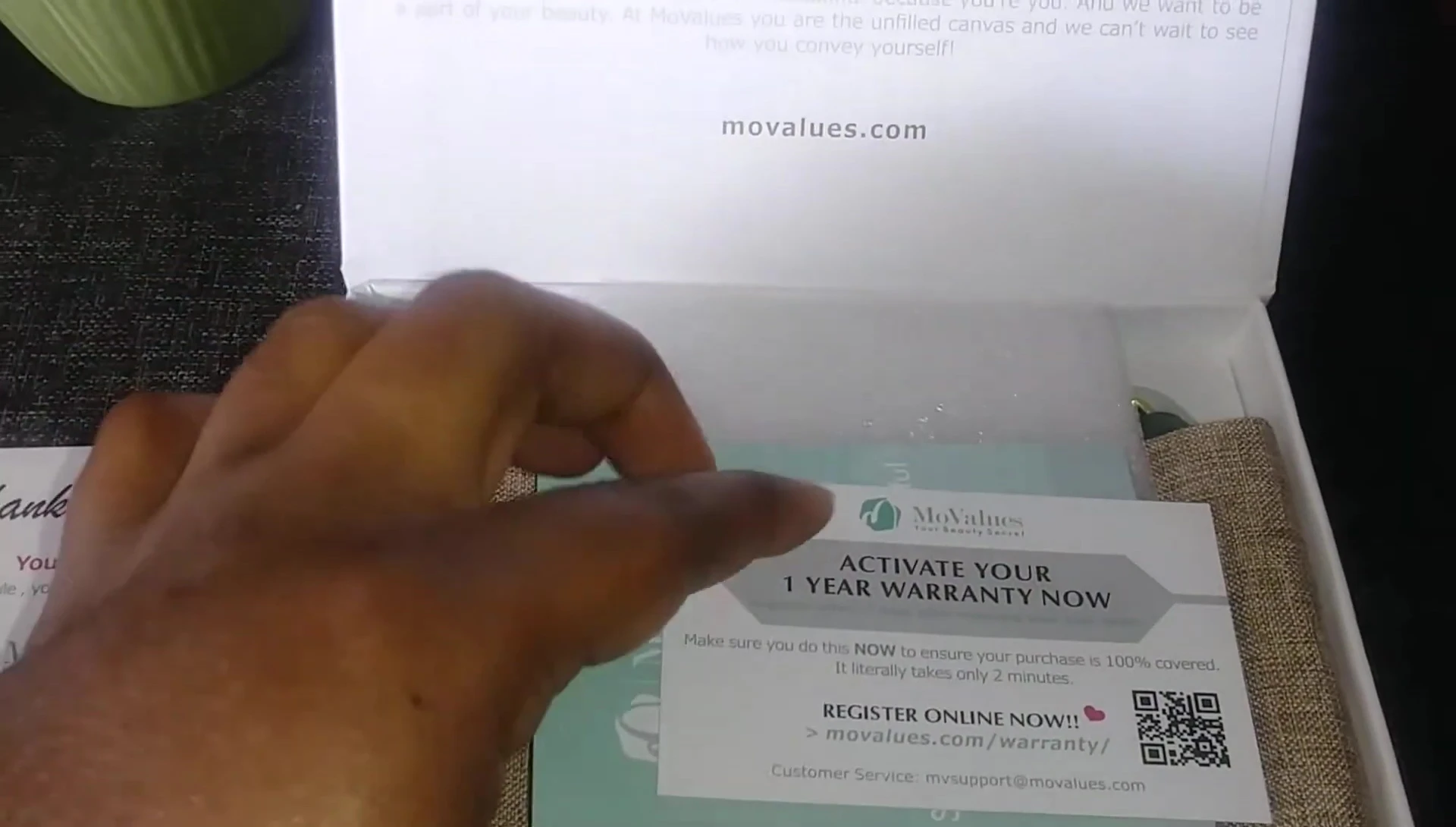 The jade roller and gua sha tool displayed within the box