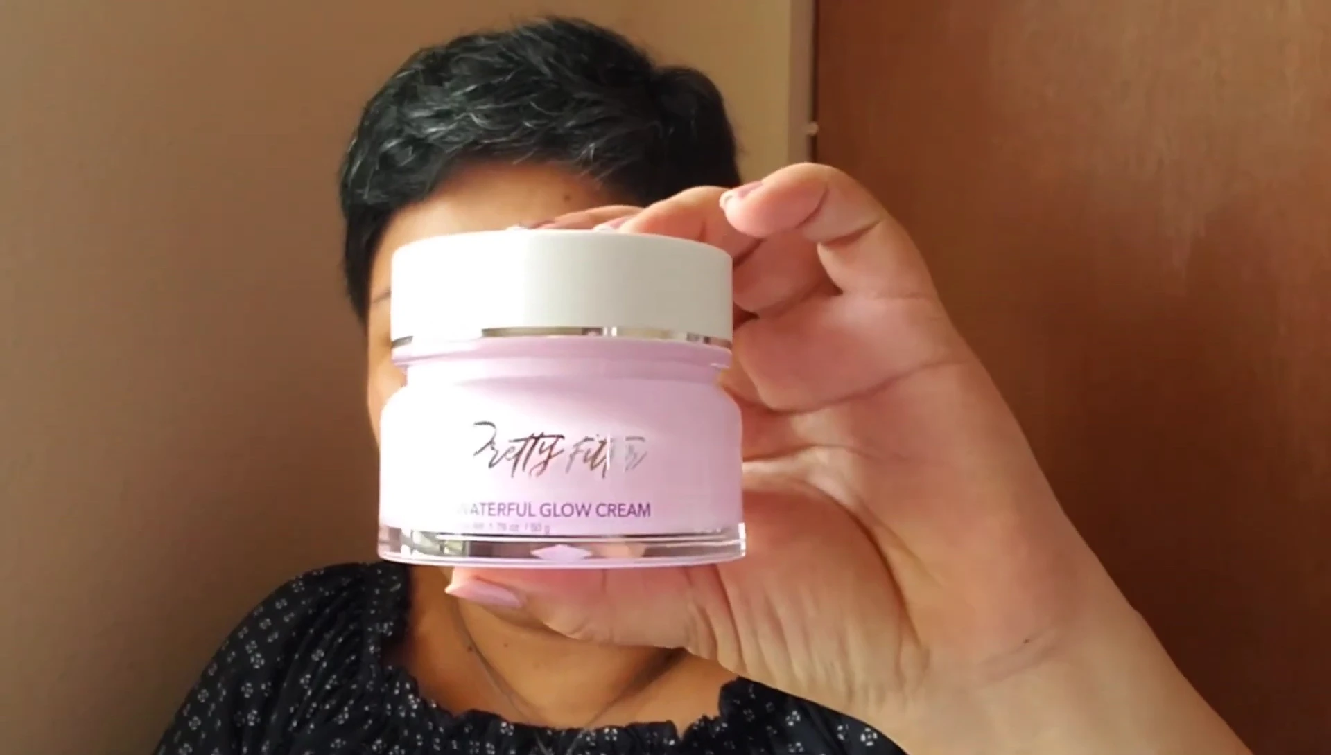 Applying moisturizer.