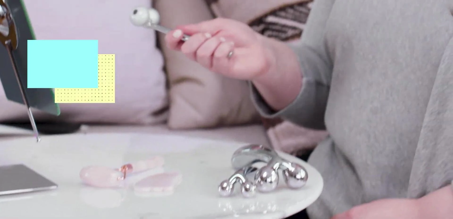 The presenter displaying a double-ended face roller.