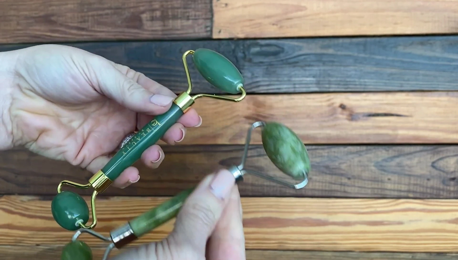 Hand holding both rollers to demonstrate the significant weight difference.