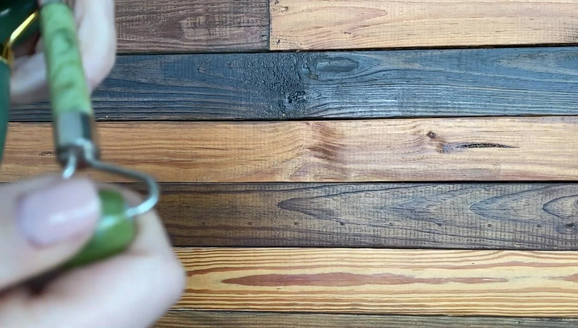 Close-up focusing on the hardware differences, showcasing the superior craftsmanship of the Beauty By Earth roller.