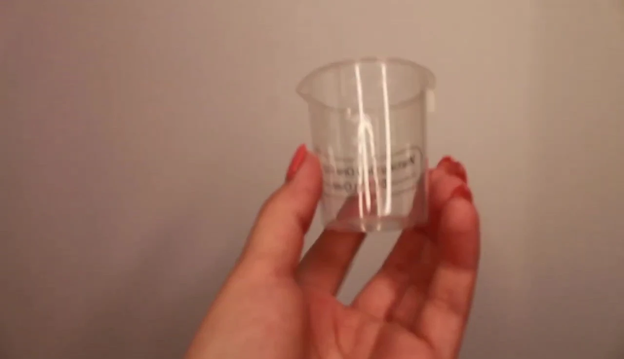The measuring cup for filling with water