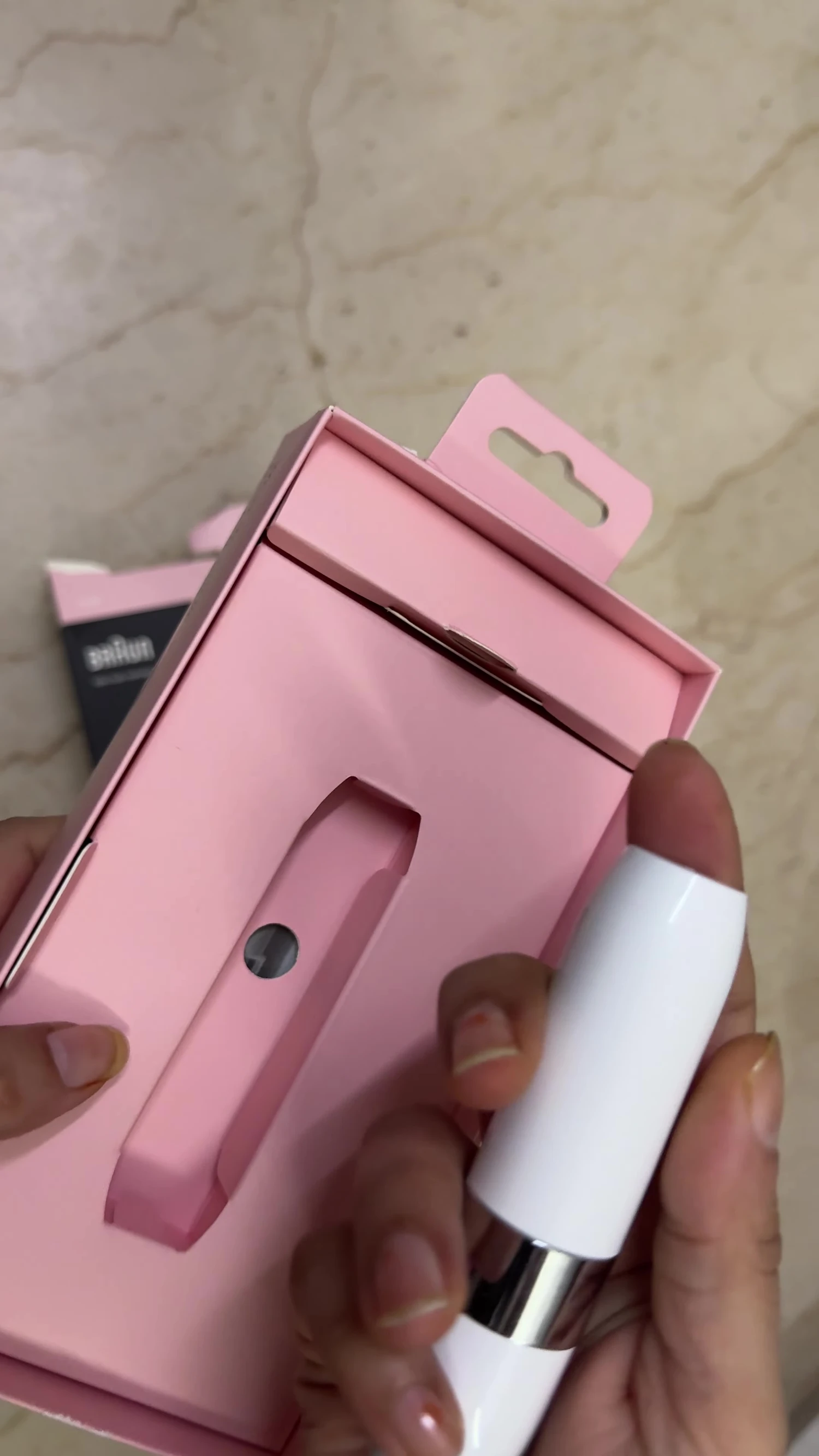 Close-up of the Braun Mini Hair Remover device