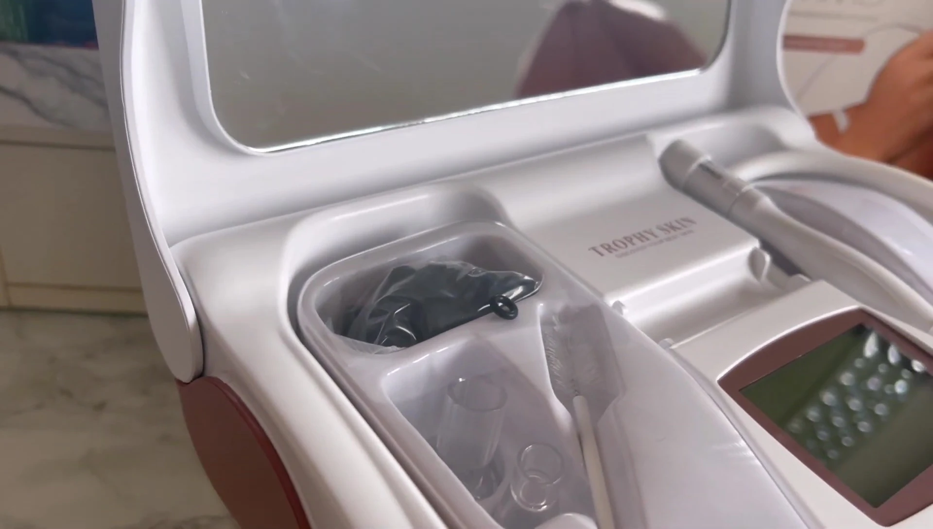Close-up of the Trophy Skin Microdermabrasion device in its packaging.
