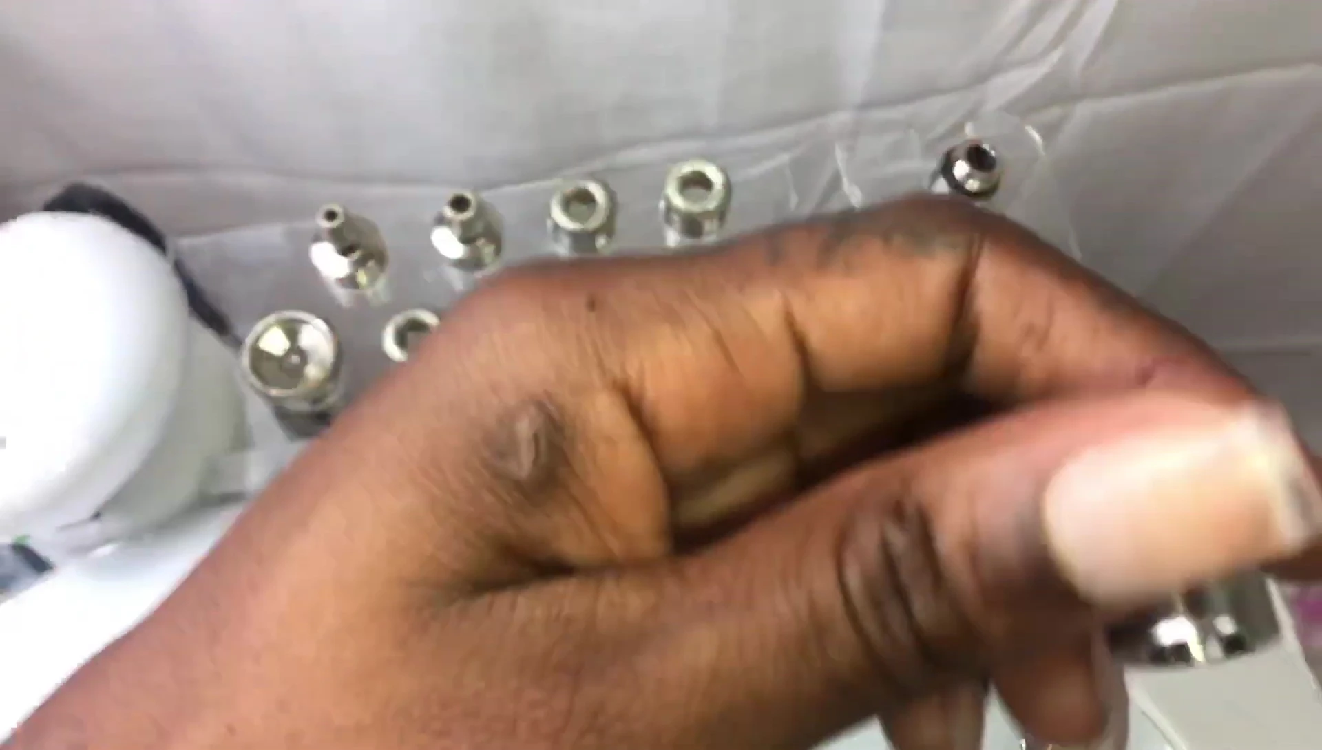 Skin buffer attachment on the microdermabrasion machine.