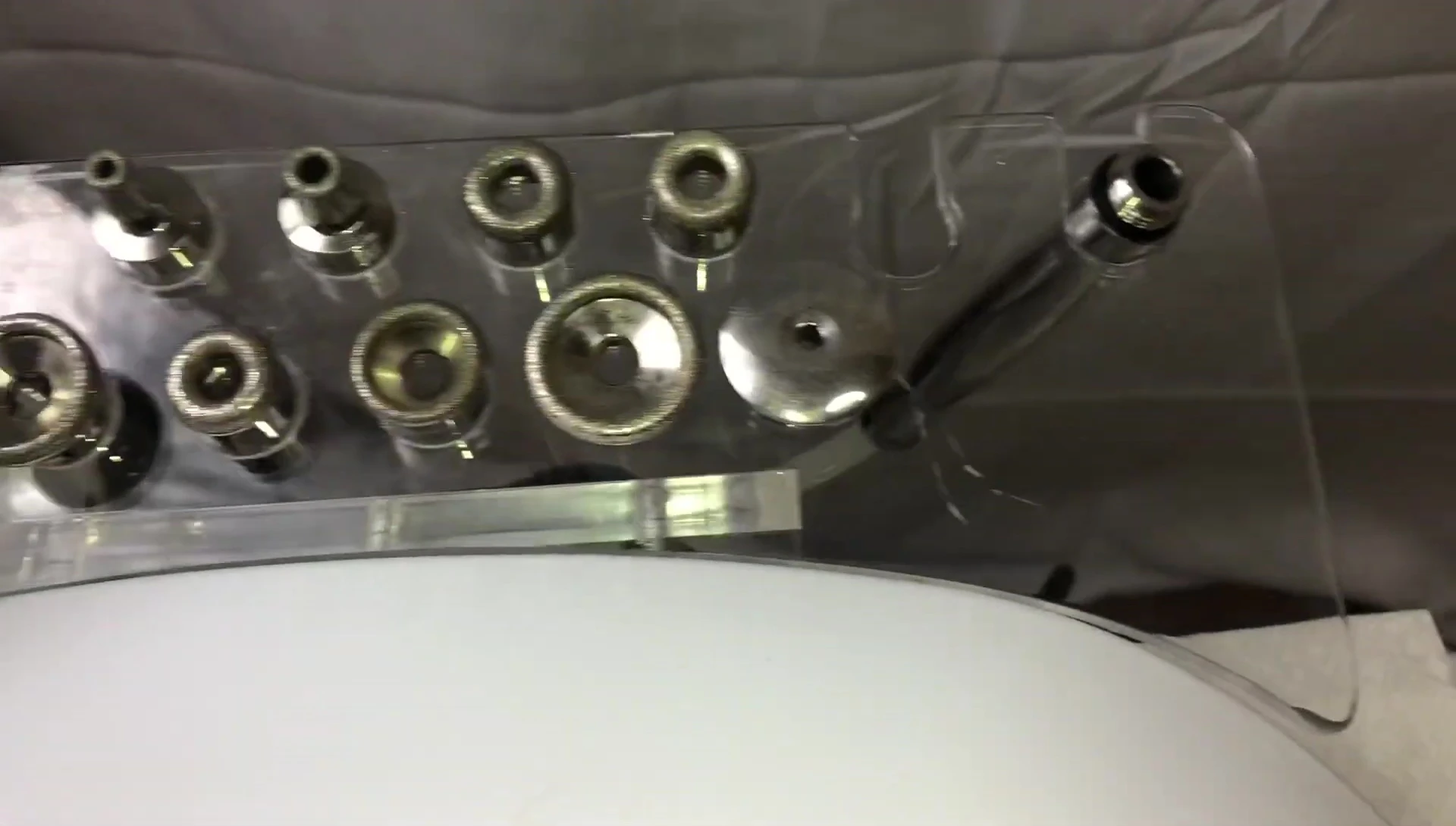 Demonstration of how to attach the diamond tip to the machine.
