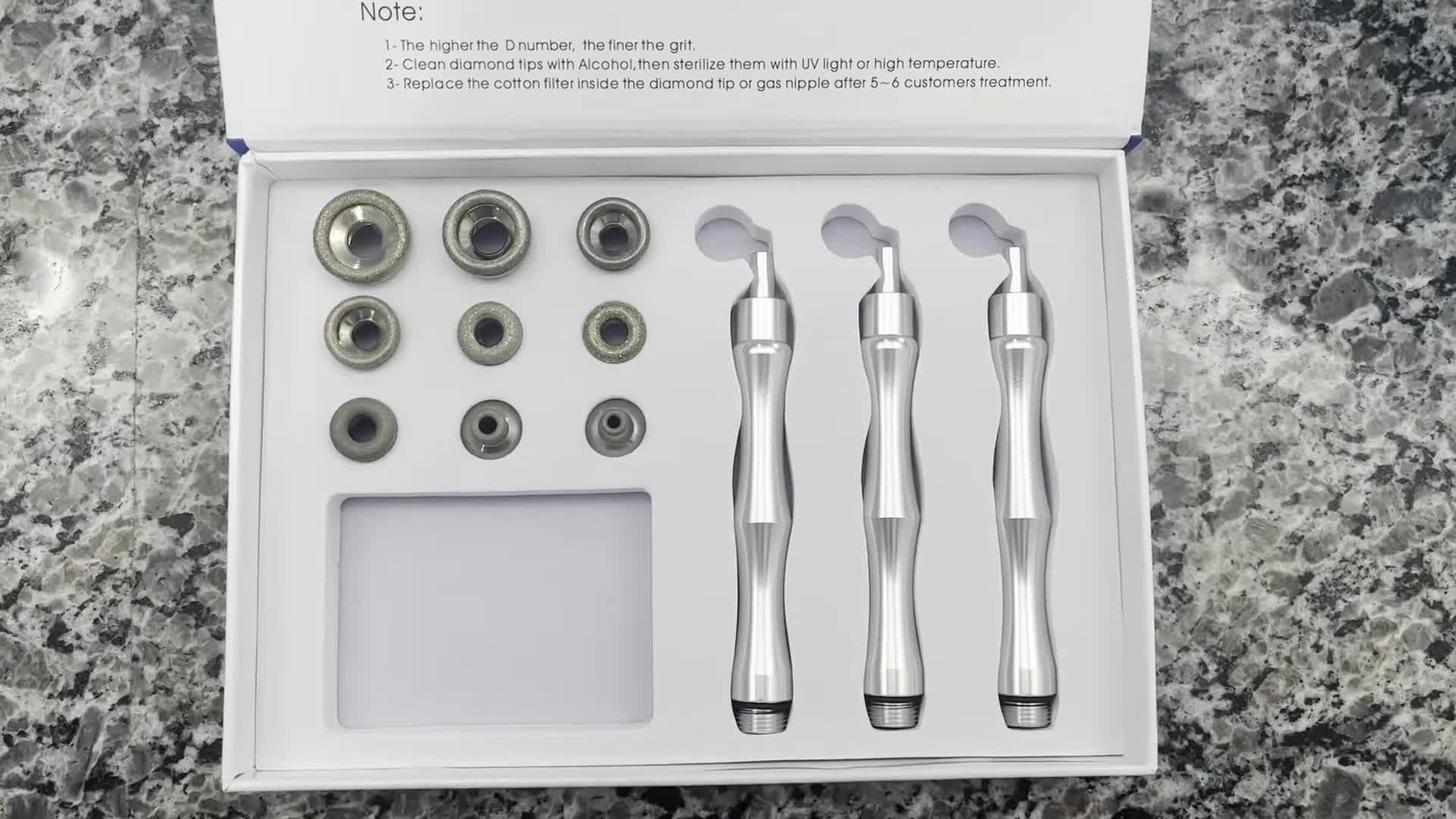 Close-up of the Yofuly device and its various diamond tips.
