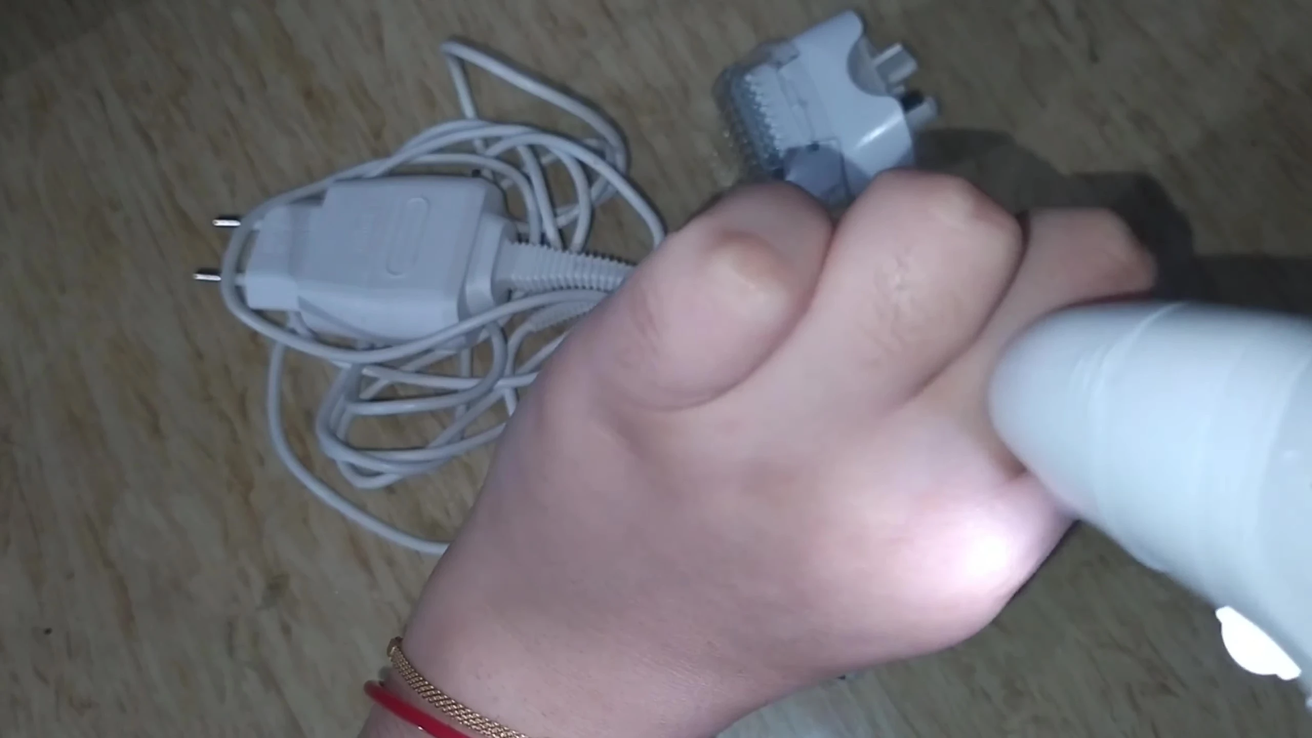 Testing the epilator on the hand, demonstrating its usage.