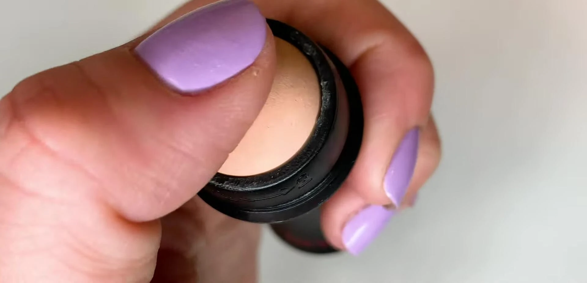 Close-up shot of the Revlon volcanic rock roller showcasing its chalky texture.