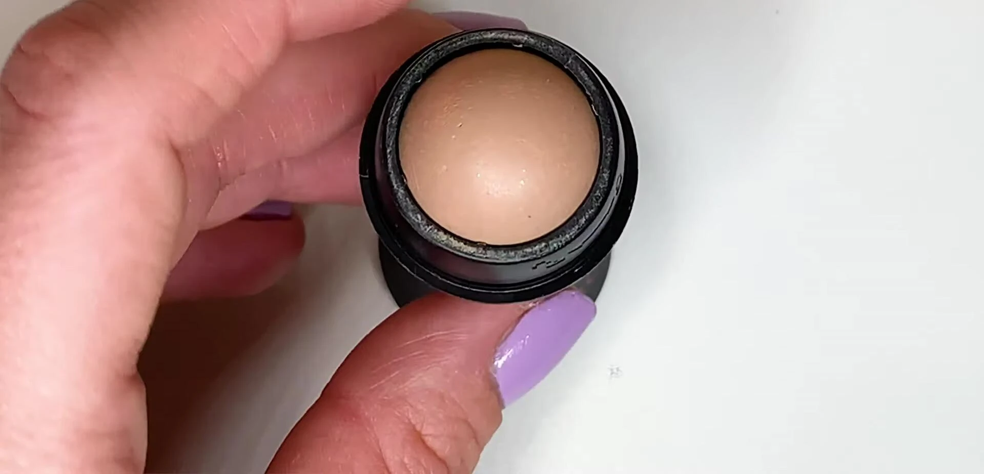 Close-up of the volcanic rock roller showing makeup transfer.