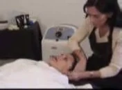 Therapist observing the client's skin.