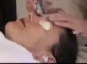 Therapist showing the sweeping motion.