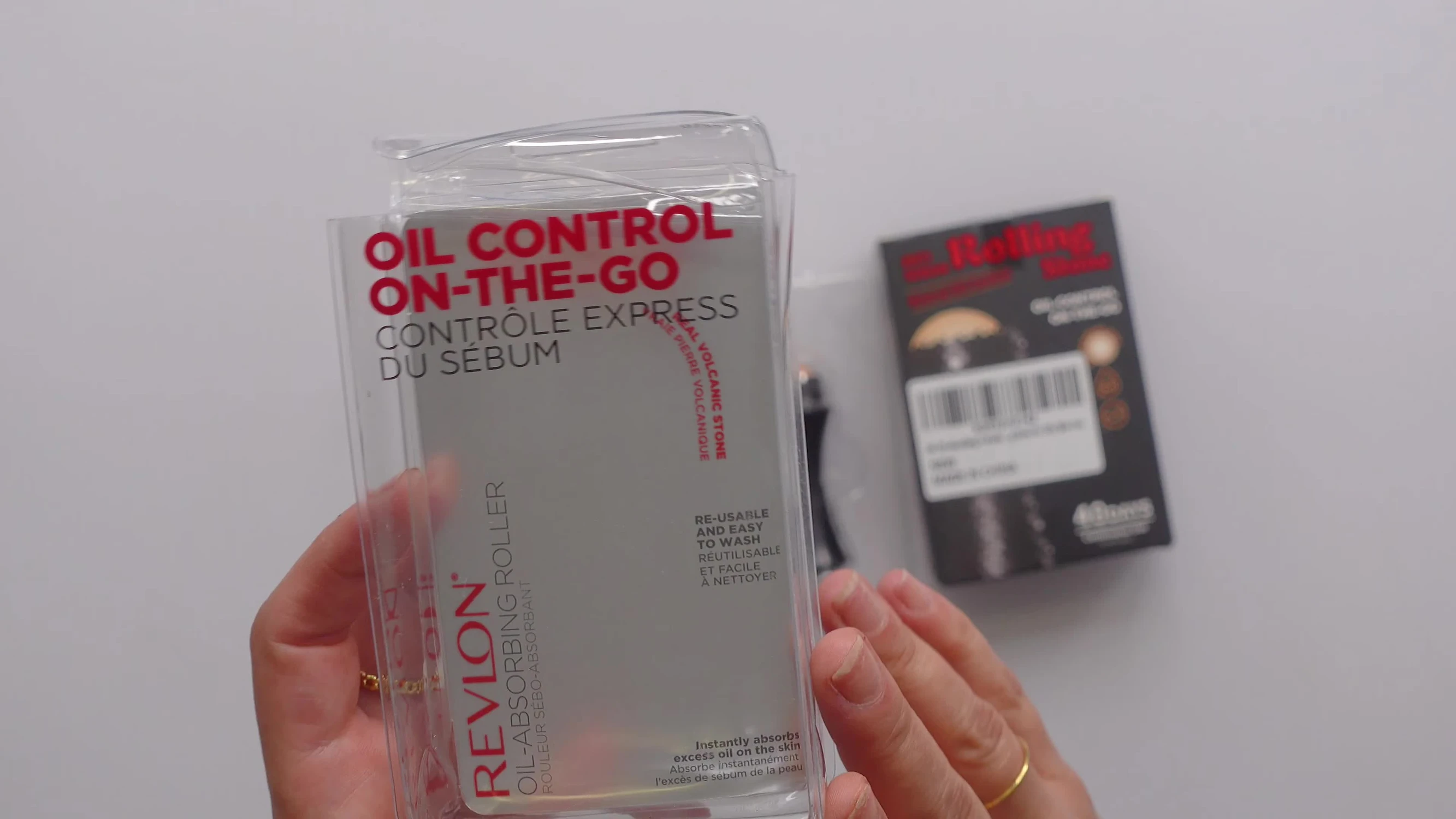Close-up shot of the Revlon Volcanic Oil Absorbing Roller packaging.