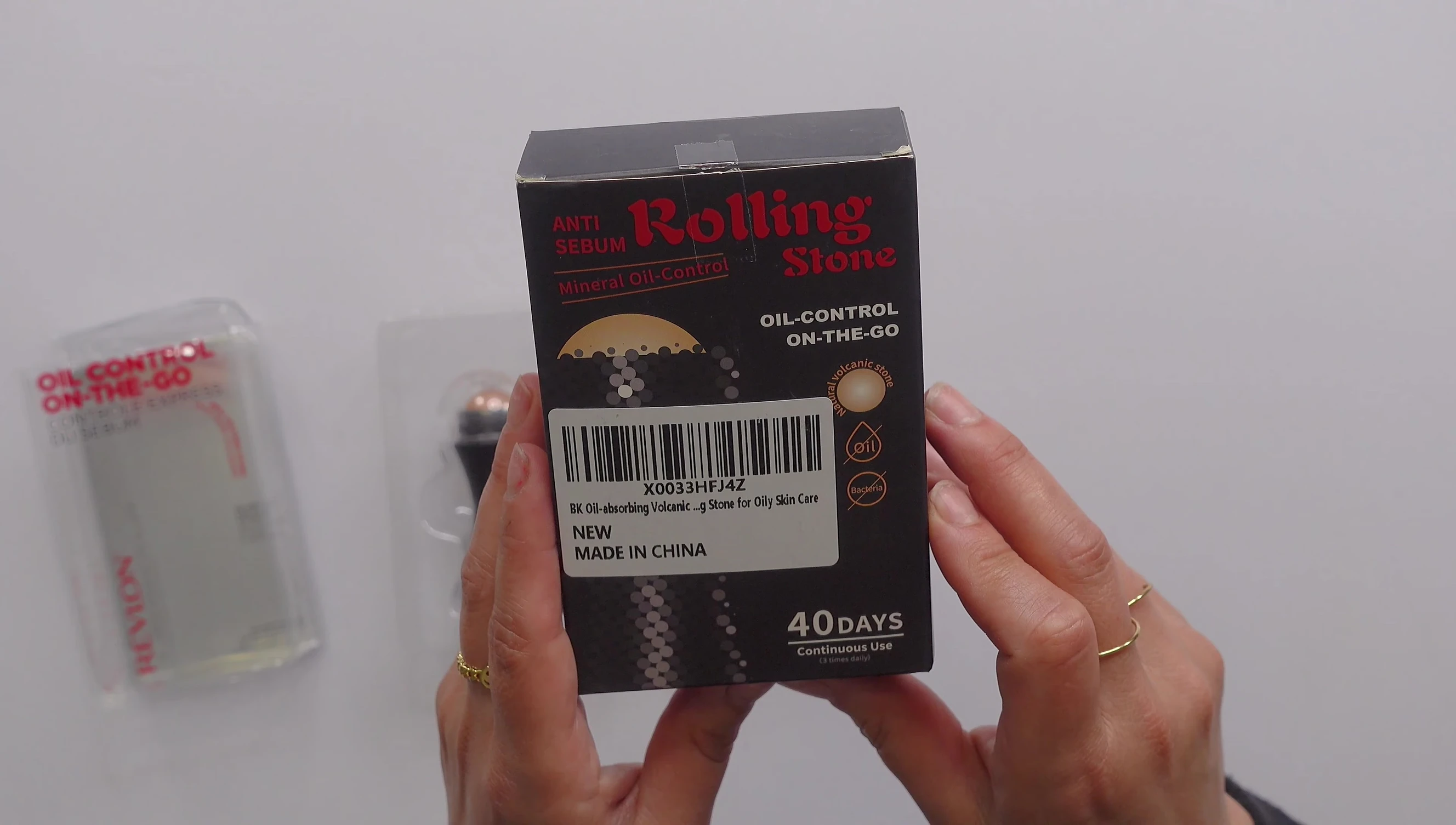 Side-by-side comparison of the Revlon and dupe roller packaging.