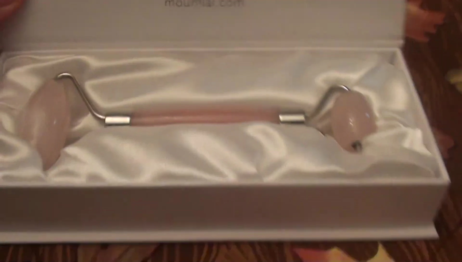 Close-up of the rose quartz roller itself