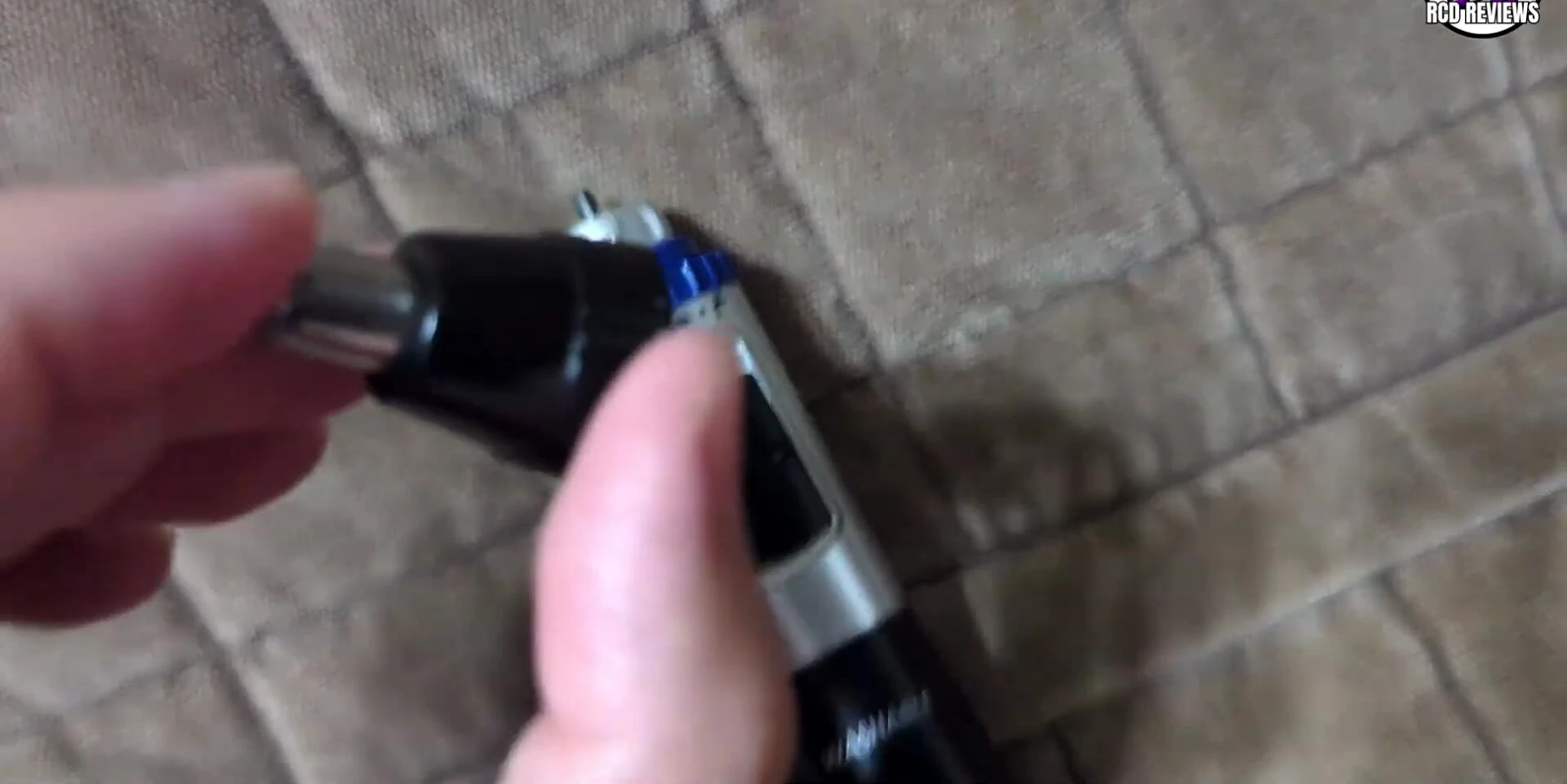 Final shot of the reviewer holding the trimmer.