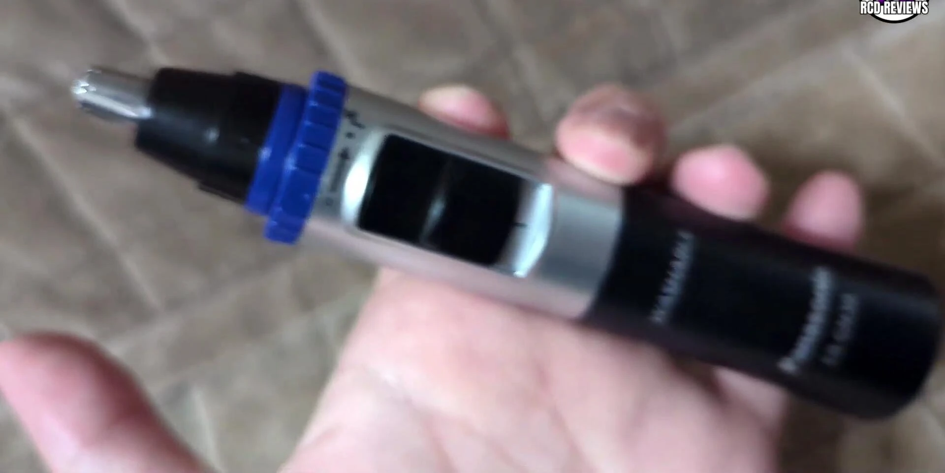 The trimmer in use, highlighting the quiet operation.