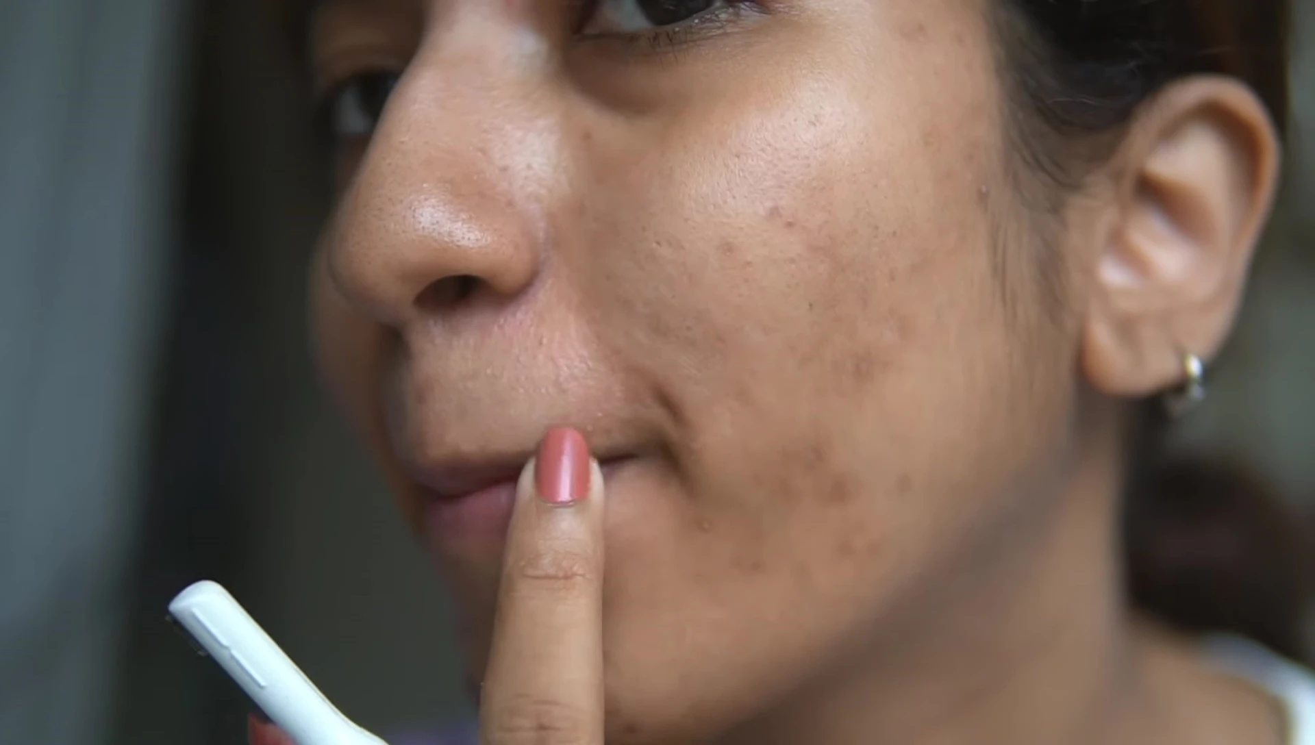 Demonstration of using the trimmer on upper lip