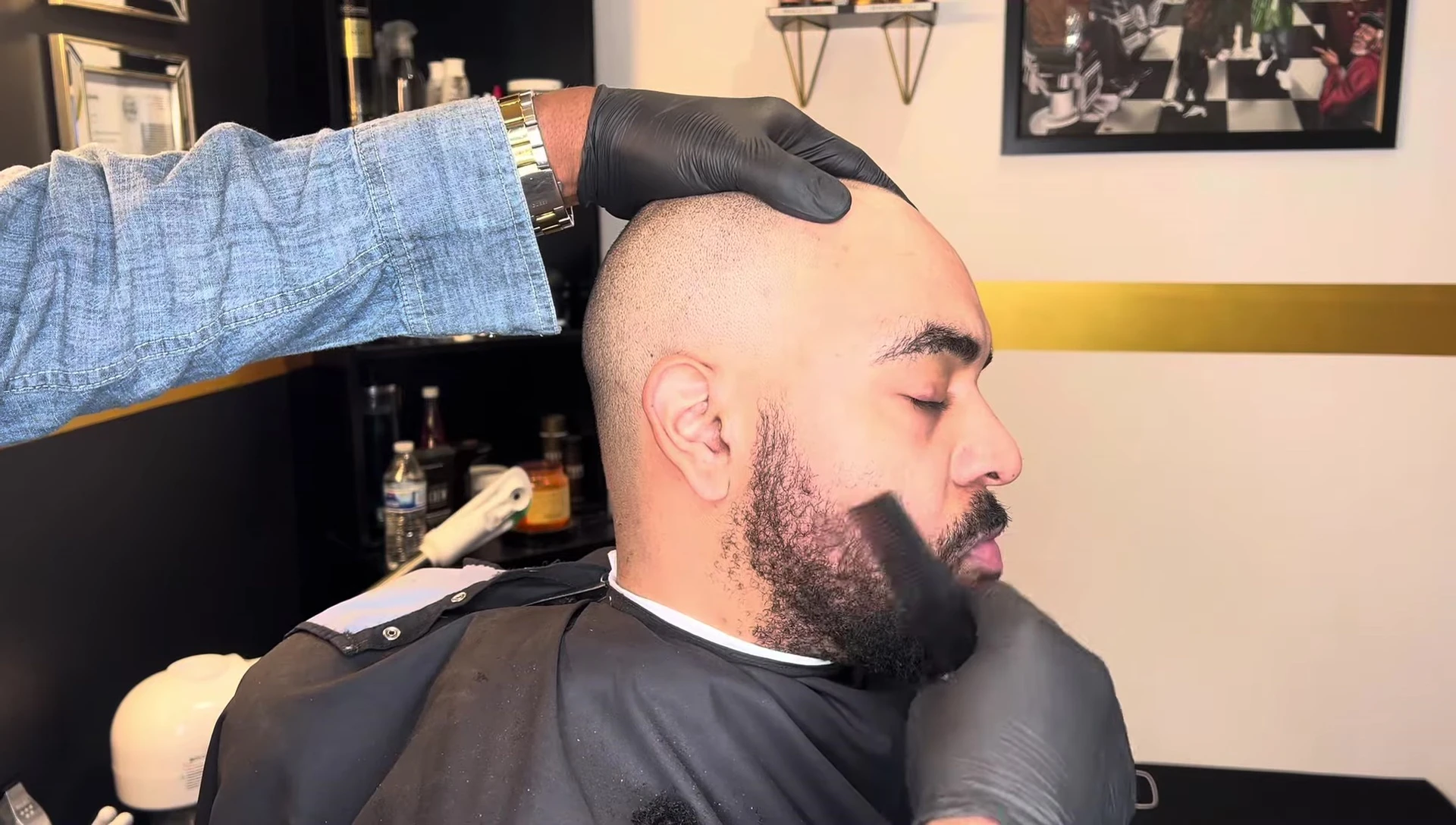 The reviewer preparing the client's beard.