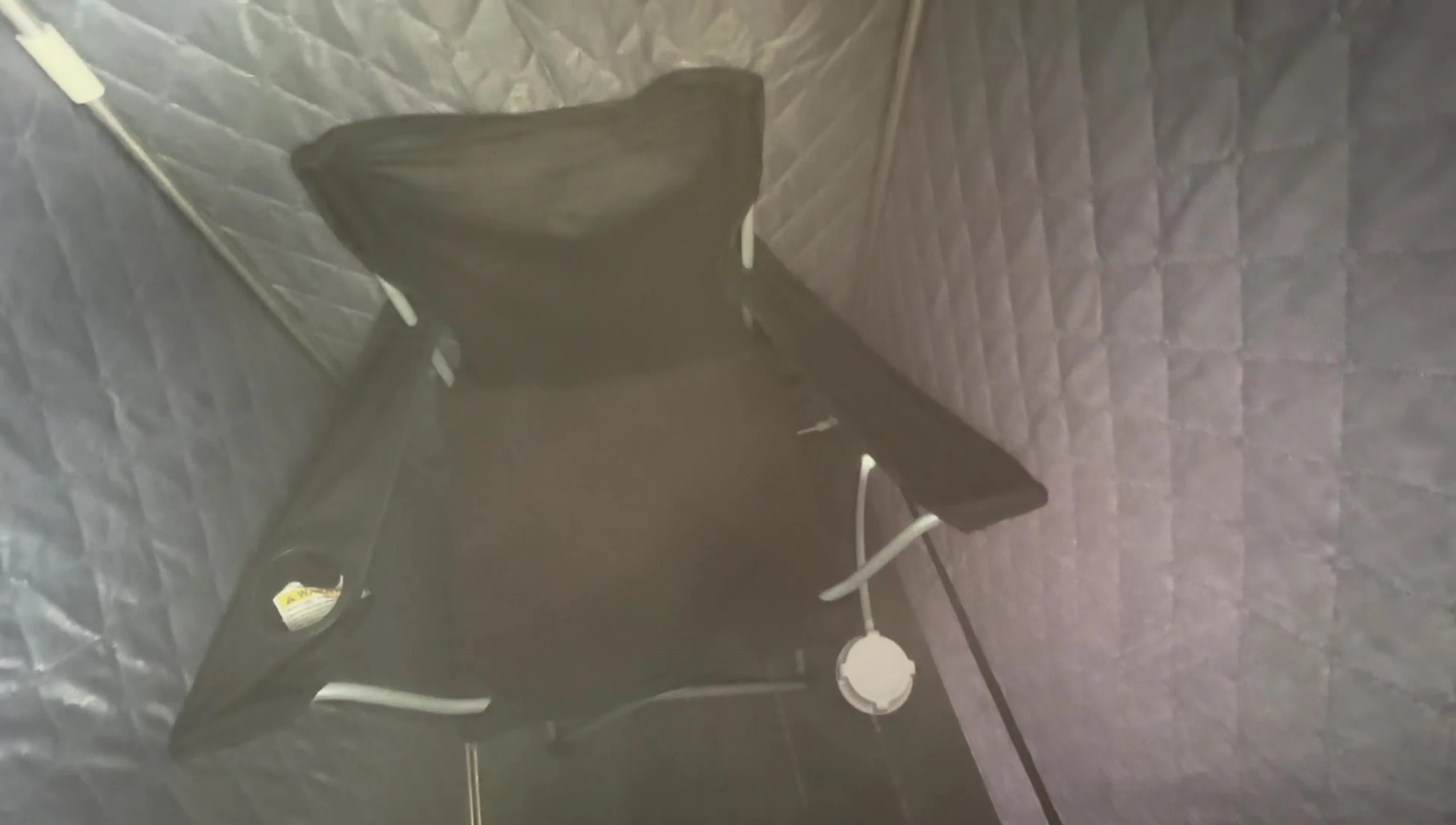 The reviewer demonstrating their larger replacement chair.