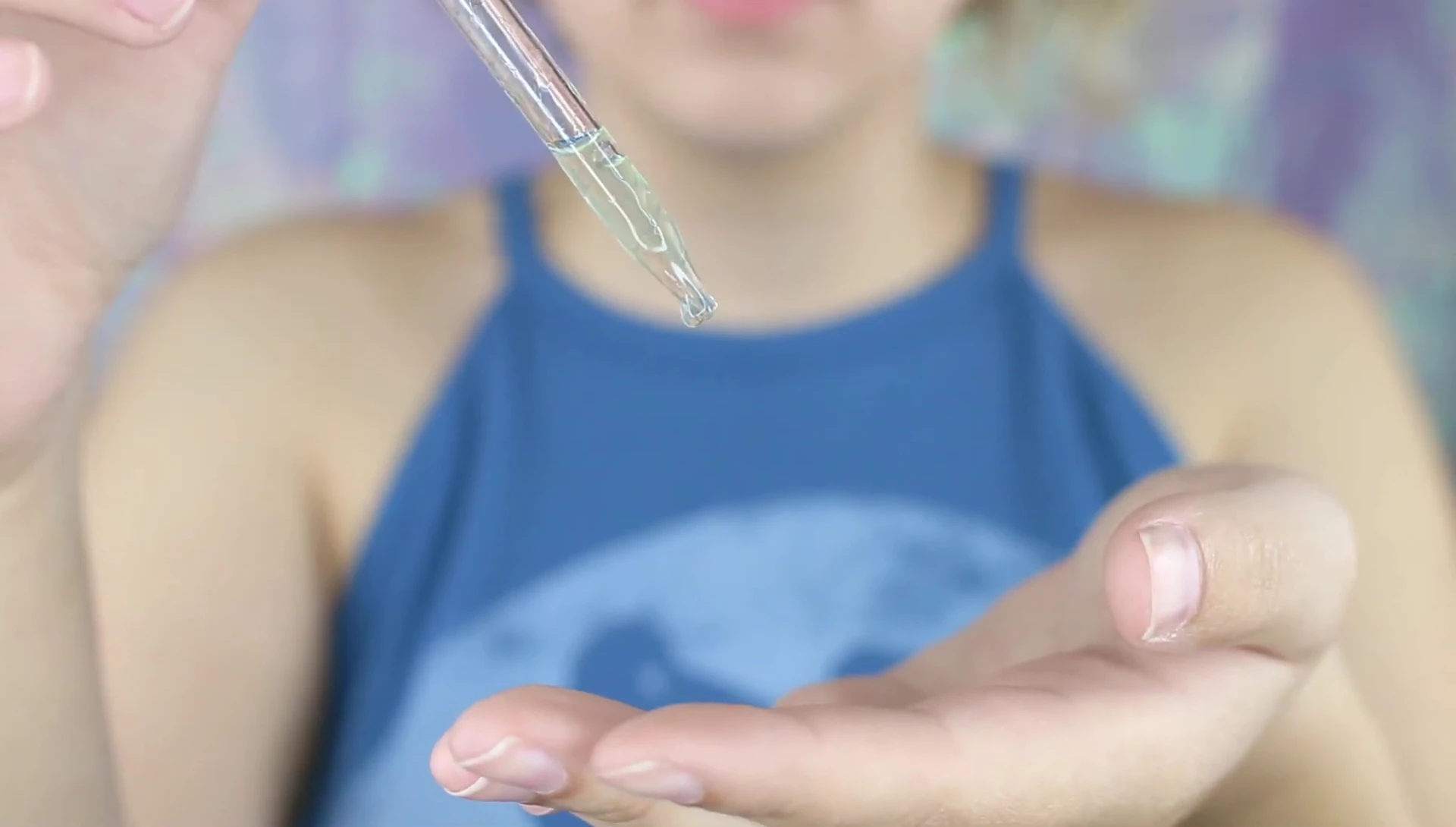 Applying skincare product before using the roller.