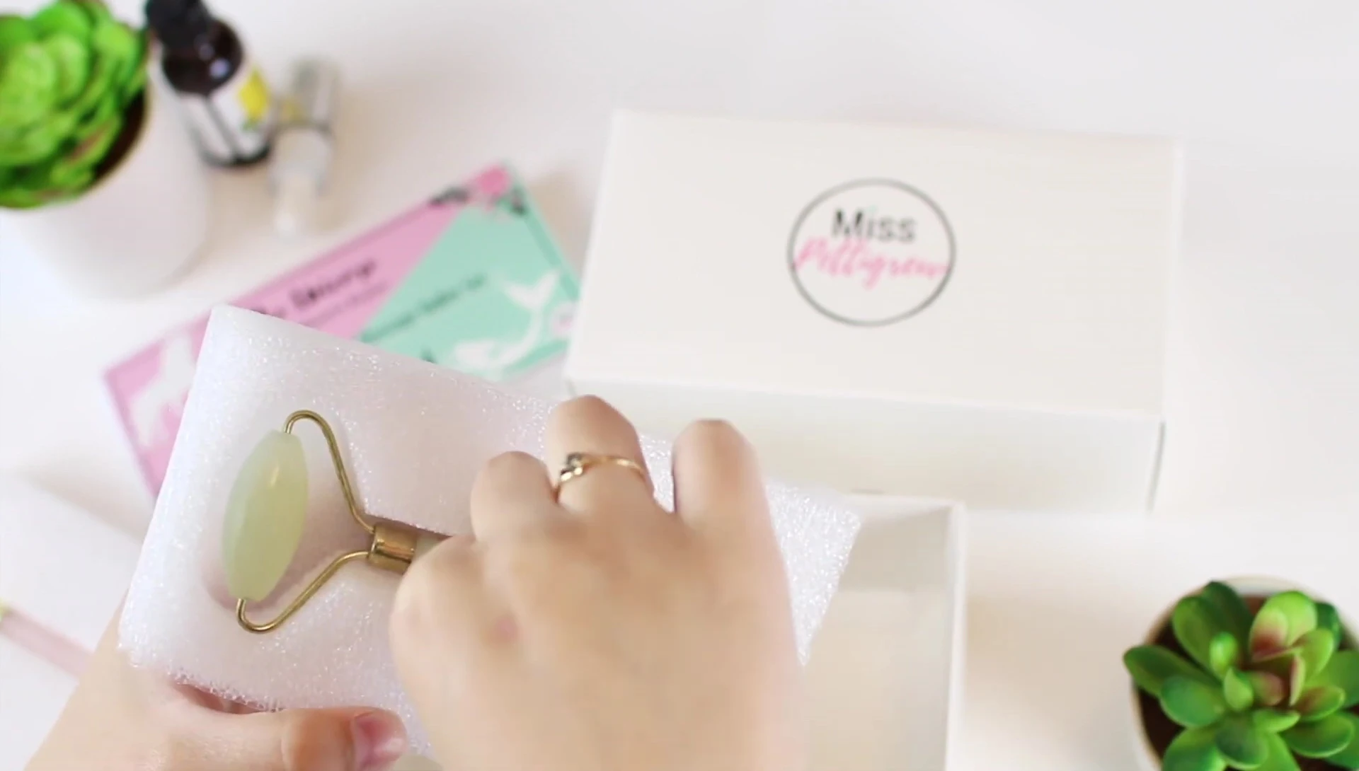 The jade roller's triple layer packaging detail.
