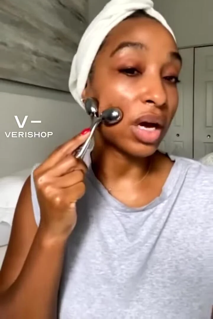 The user demonstrates the massager's action, expressing enjoyment.